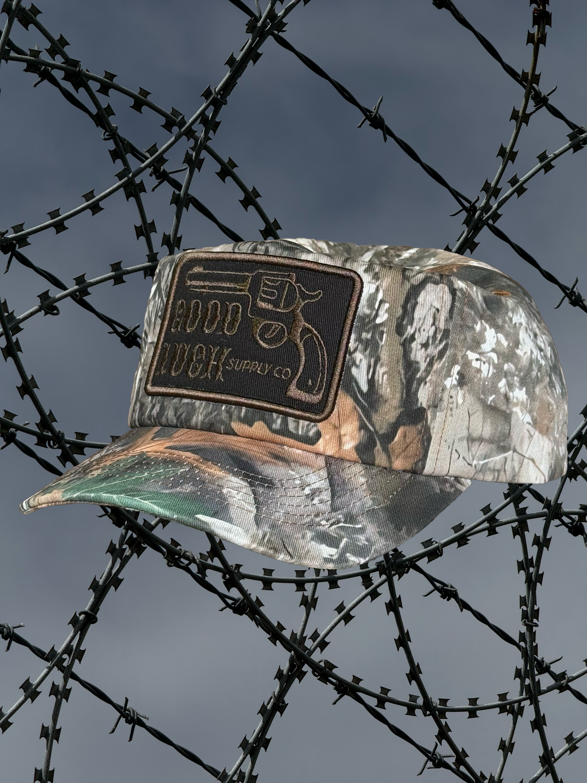 CAMO REVOLVER SNAPBACK